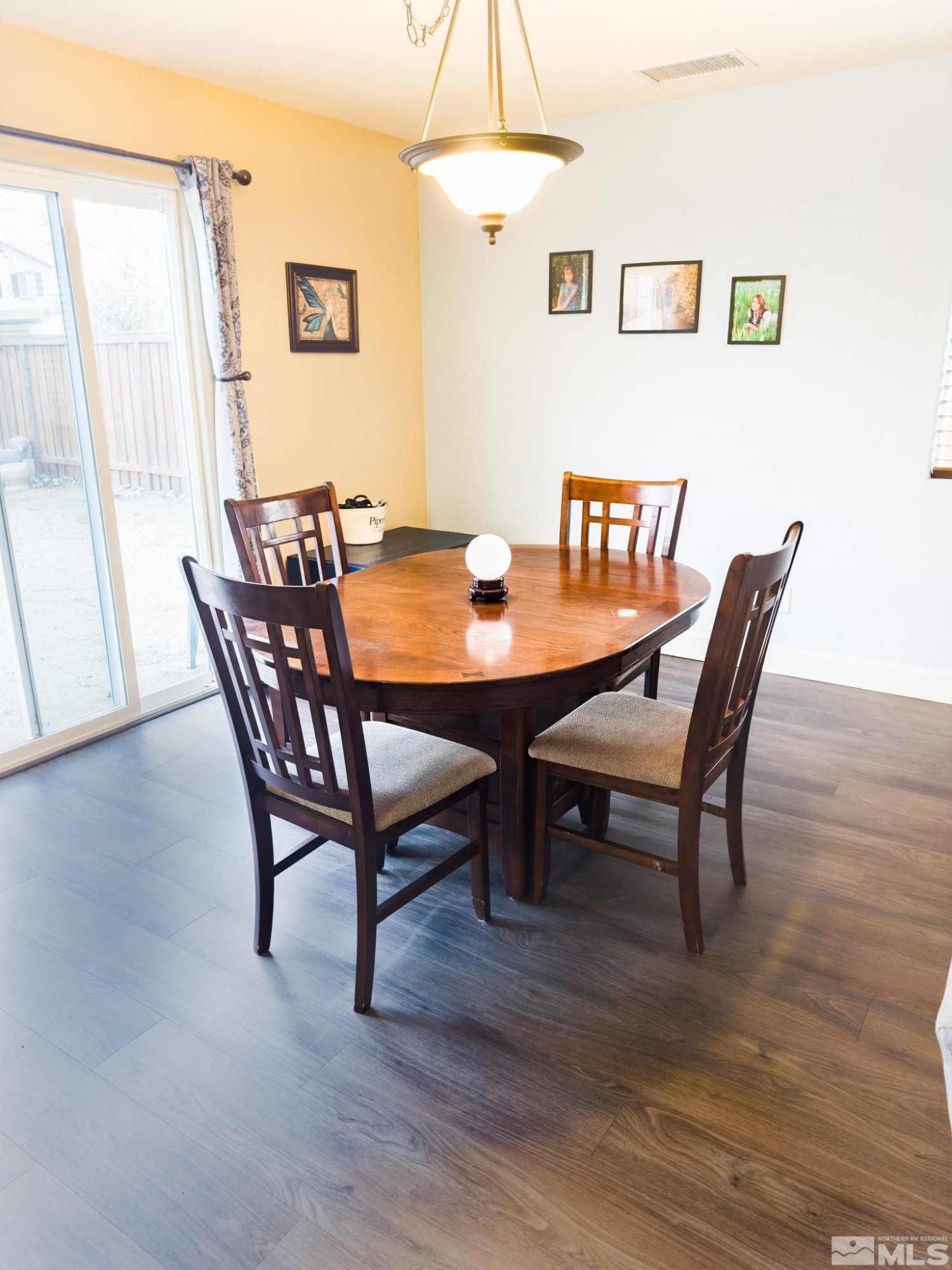 11630 Verazae Drive Reno, NV 89521 - Photo 5 of 16 a view of a dining room with furniture and wooden floor