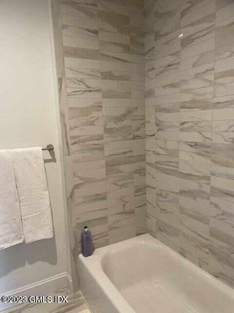 8 Sound Beach Ave Extension, Unit 4 Greenwich, CT 06878 - Photo 17 of 31 a bathroom with a bathtub