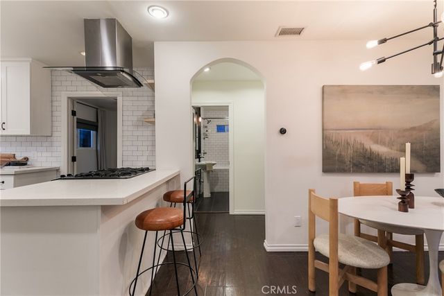 a bedroom with a bed and dresser