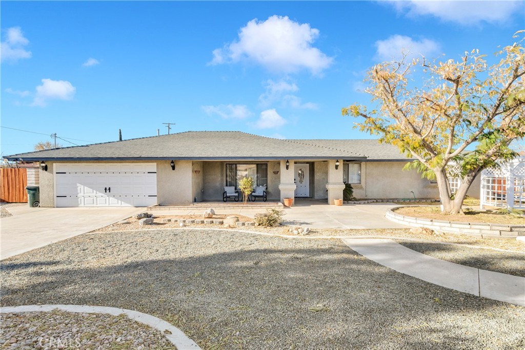 13850 Delaware Road Apple Valley, CA 92307 - Photo 1 of 1 a view of a house with snow on the road