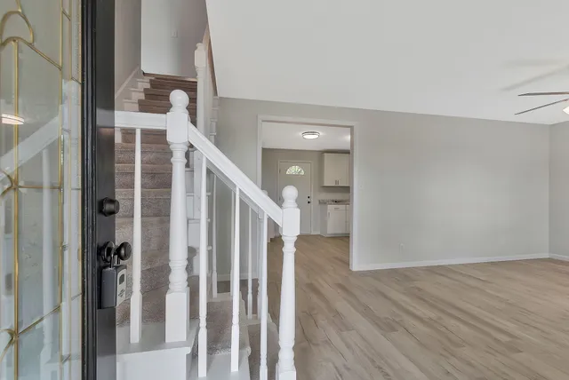 a view of entryway with wooden floor