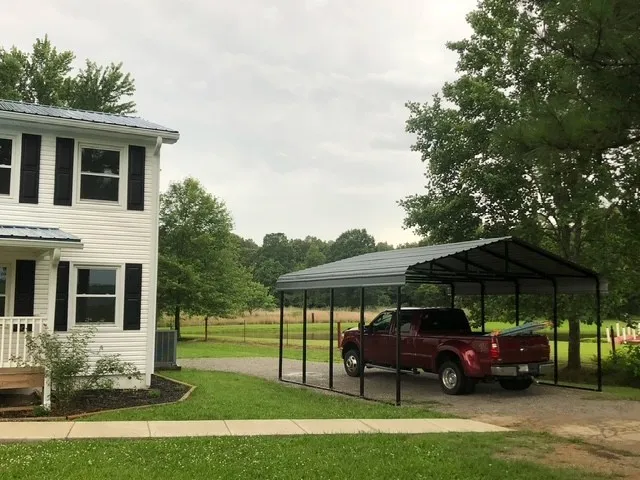 a backyard of a house with yard barbeque oven and outdoor seating