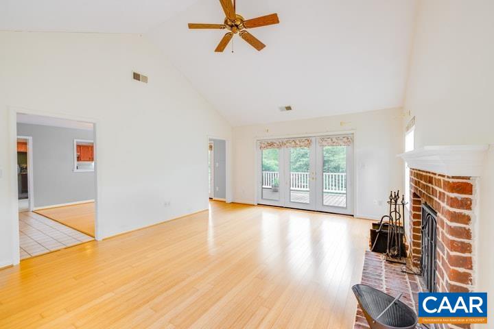998 Amber Ridge Road Charlottesville, VA 22901 - Photo 3 of 22 a view of empty room with wooden floor and fan