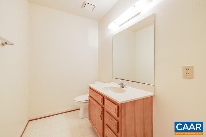 998 Amber Ridge Road Charlottesville, VA 22901 - Photo 6 of 22 a bathroom with a sink a toilet and a mirror