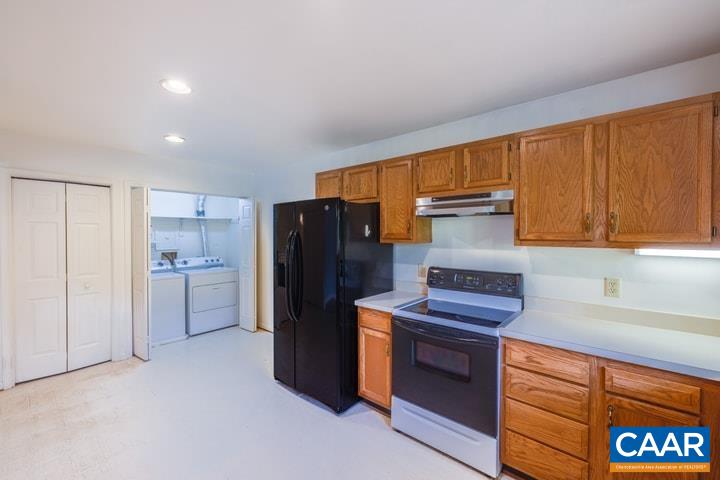 998 Amber Ridge Road Charlottesville, VA 22901 - Photo 8 of 22 a kitchen with a refrigerator and a stove top oven