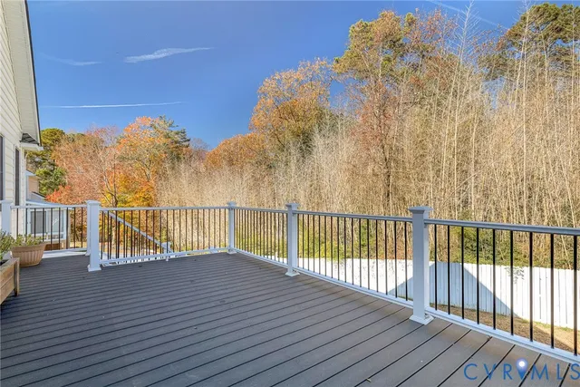 a view of balcony with wooden floor