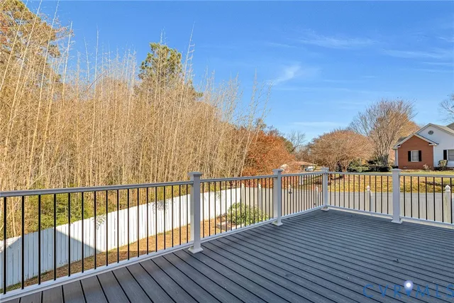 a view of a balcony with wooden fence