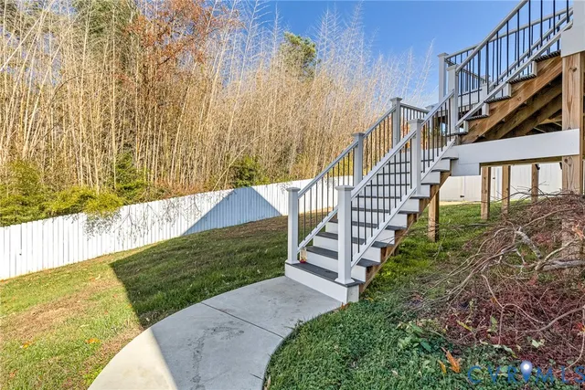 a view of an entrance to house with backyard
