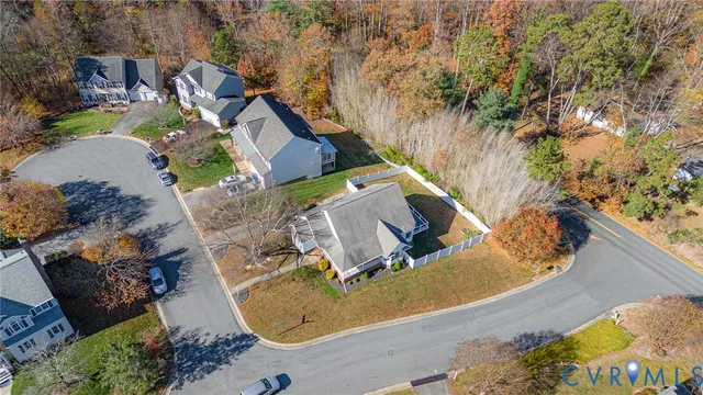 an aerial view of a house with outdoor space