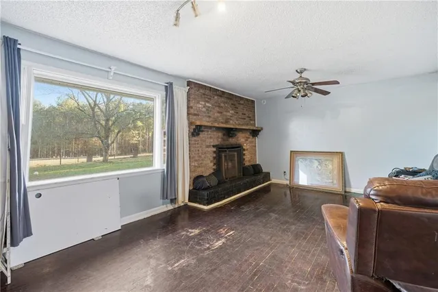 a view of fireplace and wooden floor
