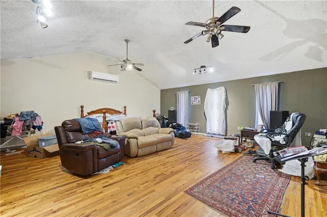 a bed room with a bed and a flat screen tv