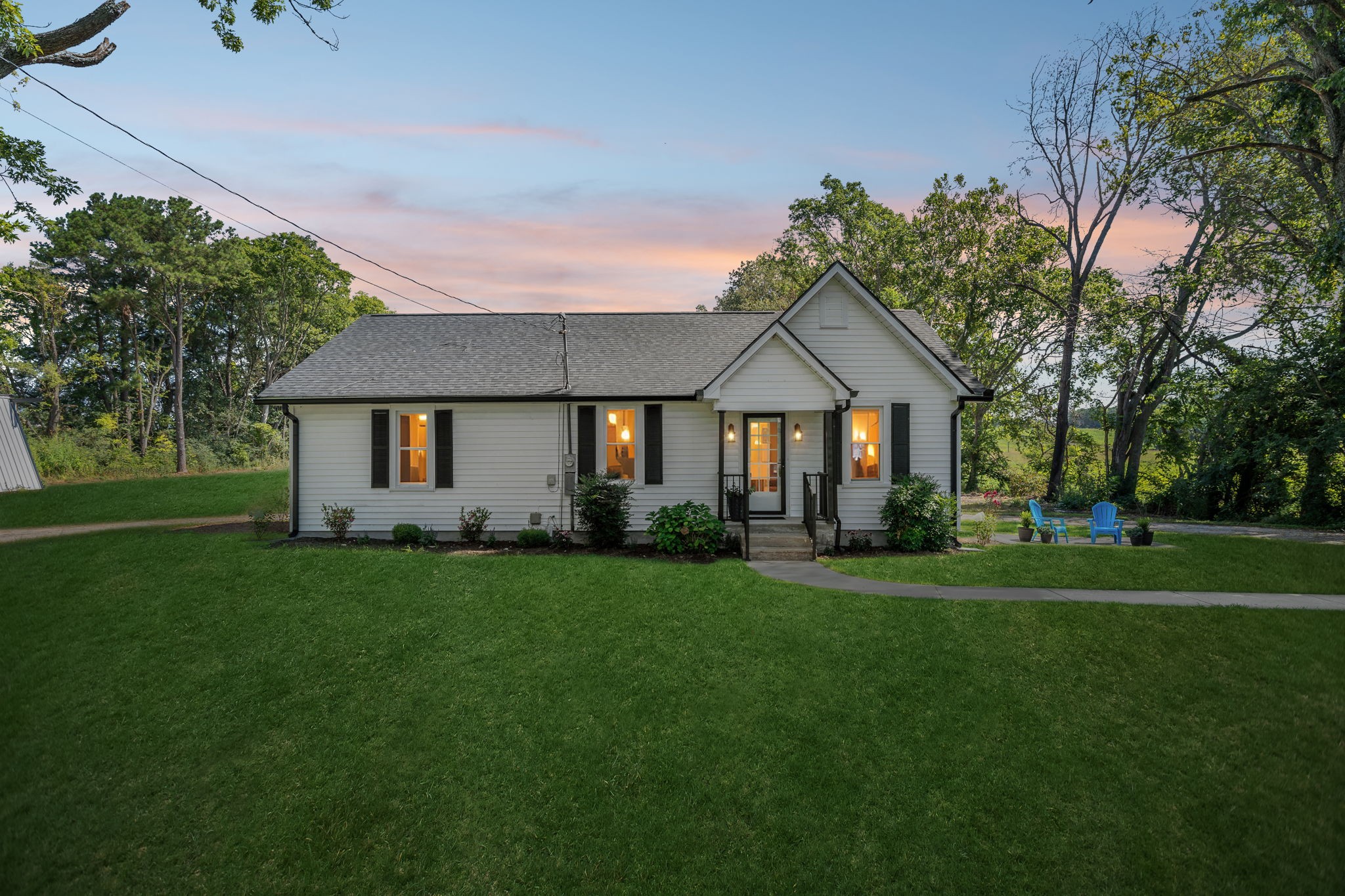 a front view of a house with a yard