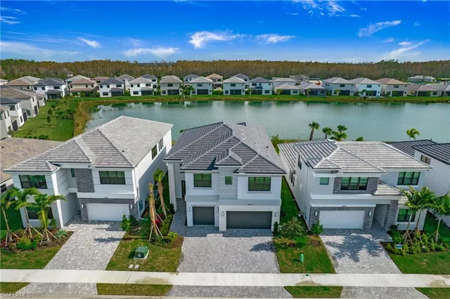 an aerial view of a house with a lake view
