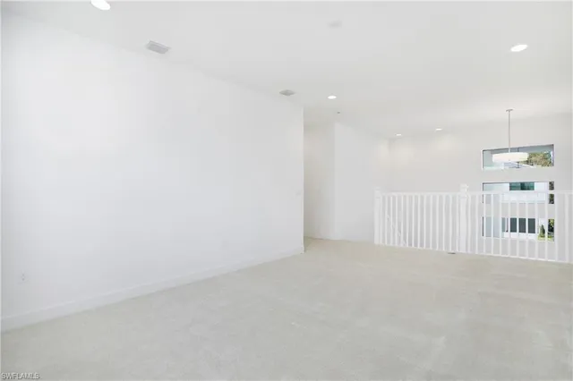 a bathroom with a tub a double vanity sink and a mirror