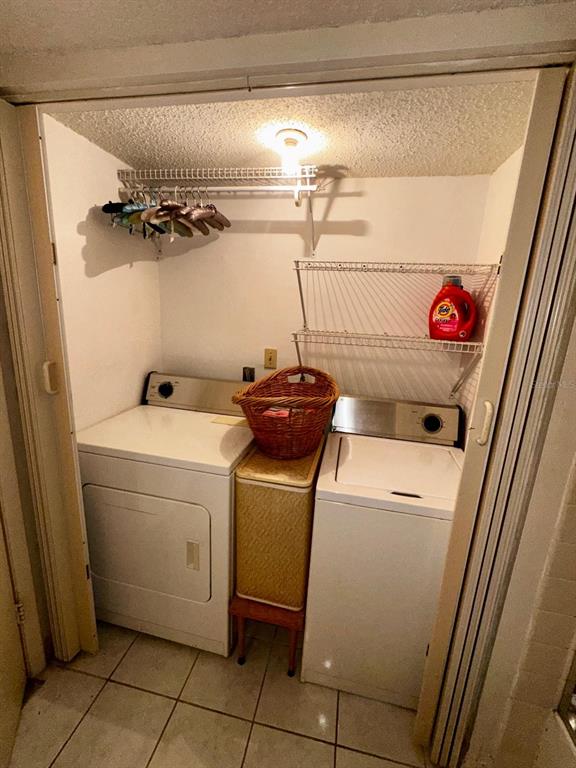 7040 Cognac Drive, Unit 1 New Port Richey, FL 34653 - Photo 21 of 45 a utility room with dryer and washer