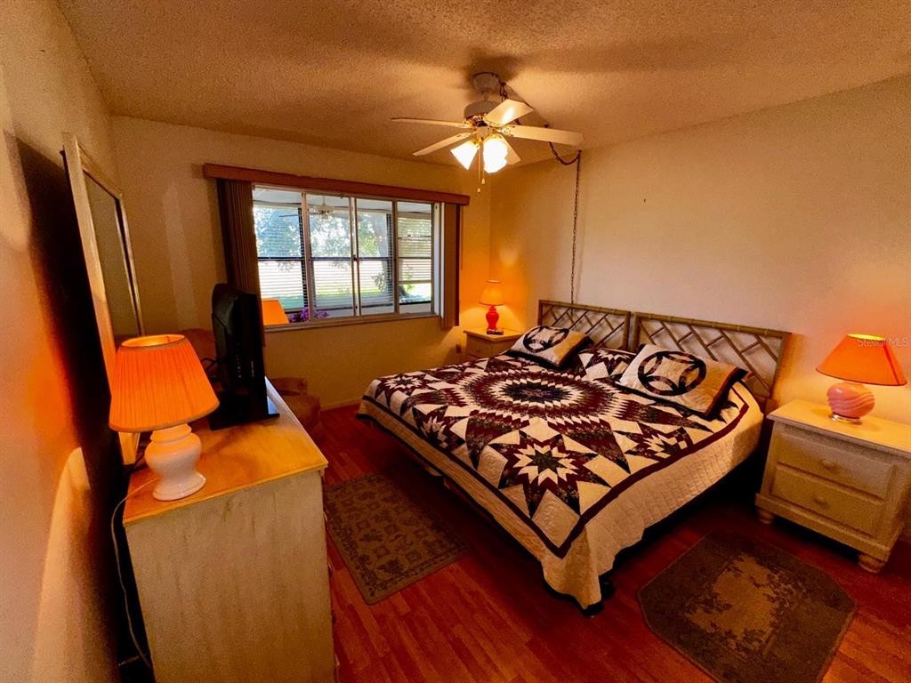 7040 Cognac Drive, Unit 1 New Port Richey, FL 34653 - Photo 25 of 45 a bed sitting in a room next to a window