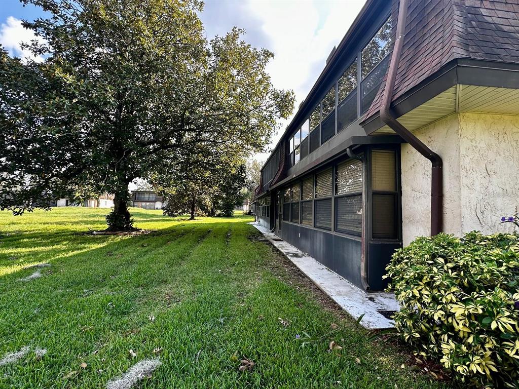 7040 Cognac Drive, Unit 1 New Port Richey, FL 34653 - Photo 36 of 45 a view of swimming pool with a backyard