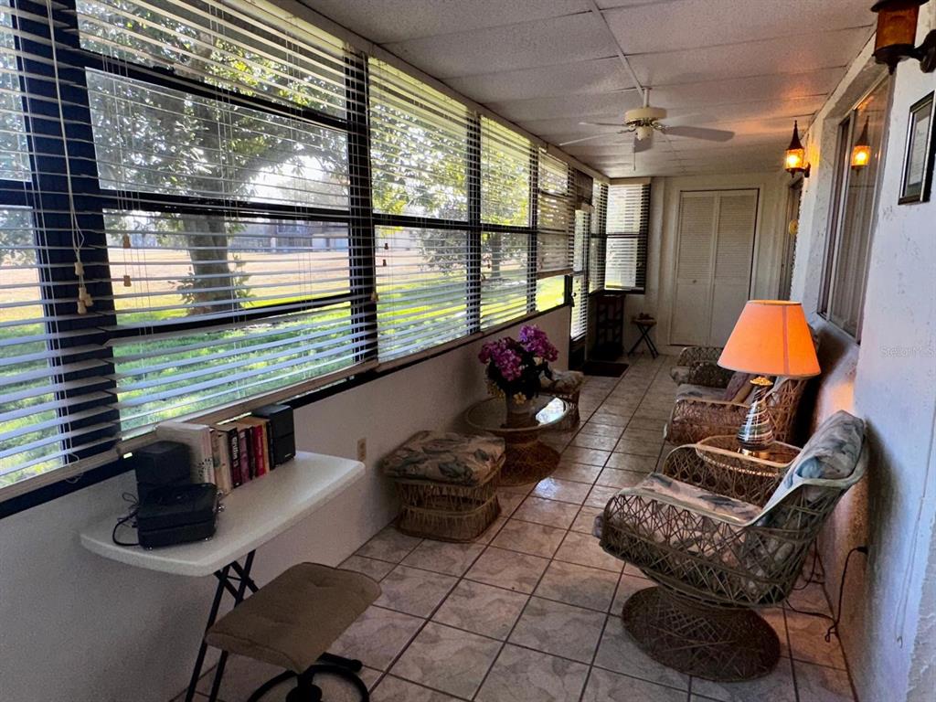 7040 Cognac Drive, Unit 1 New Port Richey, FL 34653 - Photo 8 of 45 a room with furniture and a large window