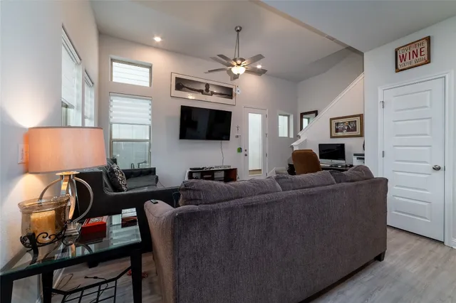 a view of kitchen with microwave stove top oven and cabinets