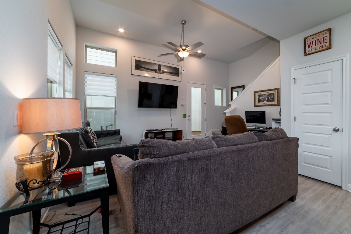 8505 Leroi Drive, Unit 358 Austin, TX 78744 - Photo 11 of 37 a living room with furniture a flat screen tv and a fireplace