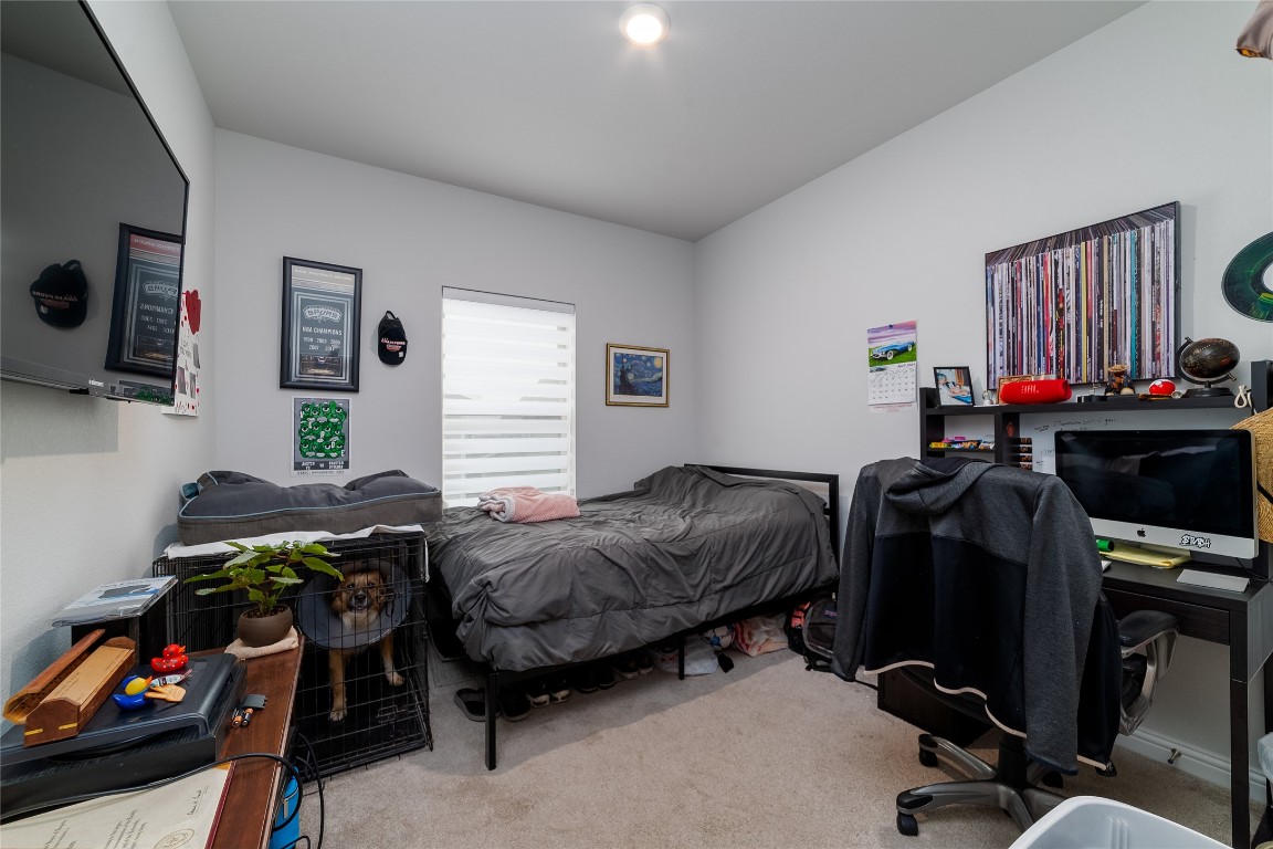 8505 Leroi Drive, Unit 358 Austin, TX 78744 - Photo 13 of 37 a bedroom with furniture and a window