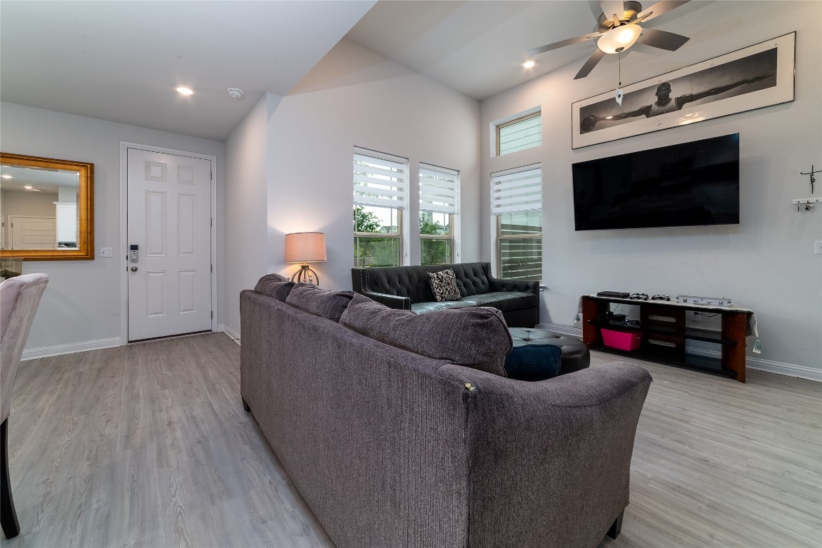 8505 Leroi Drive, Unit 358 Austin, TX 78744 - Photo 21 of 37 a living room with furniture and a flat screen tv