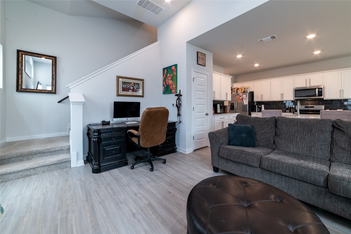 8505 Leroi Drive, Unit 358 Austin, TX 78744 - Photo 24 of 37 a living room with furniture and a flat screen tv