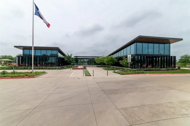 a kitchen with stainless steel appliances kitchen island granite countertop a sink a counter space and cabinets