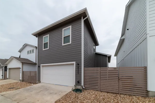 a front view of a house with a garage