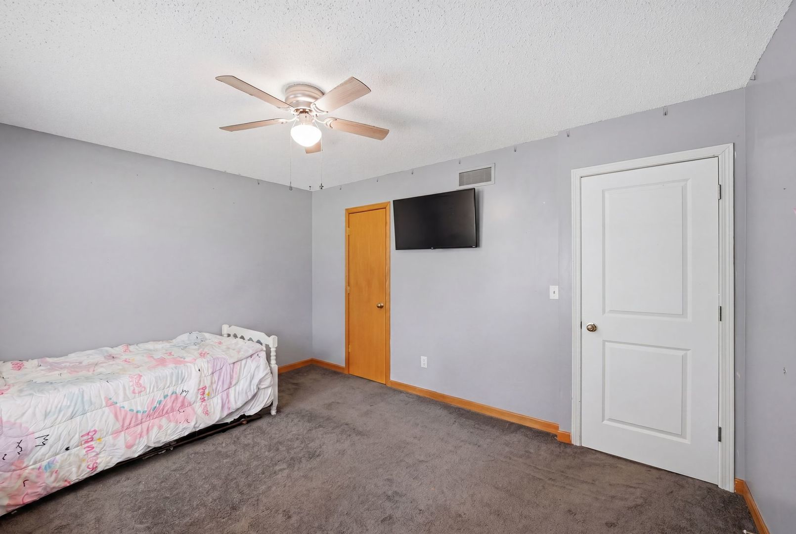 5645 Beebe Drive Rochelle, IL 61068 - Photo 23 of 43 a bedroom with a bed and a flat screen tv