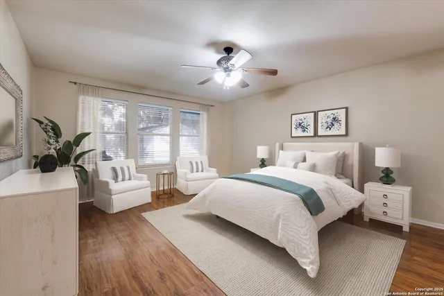 a spacious bedroom with a bed and a couch