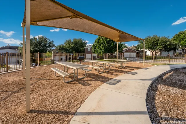a view of a swimming pool with a patio