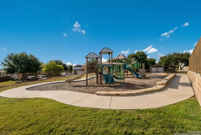 a view of a swimming pool with an outdoor space and seating area