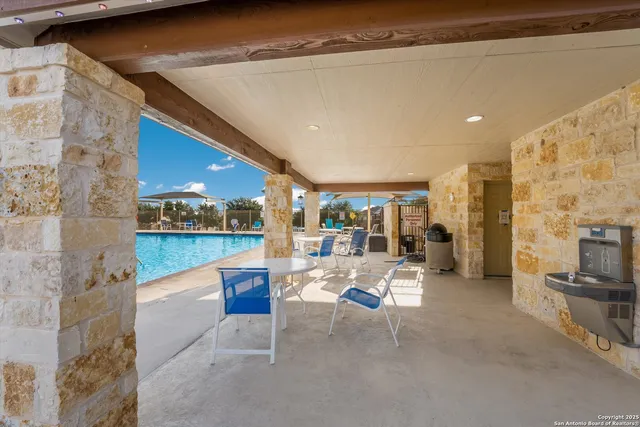 a lobby with furniture and a flat screen tv