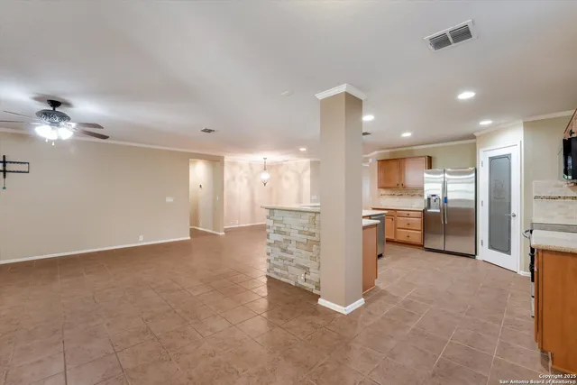 a view of a kitchen with a sink and cabinets