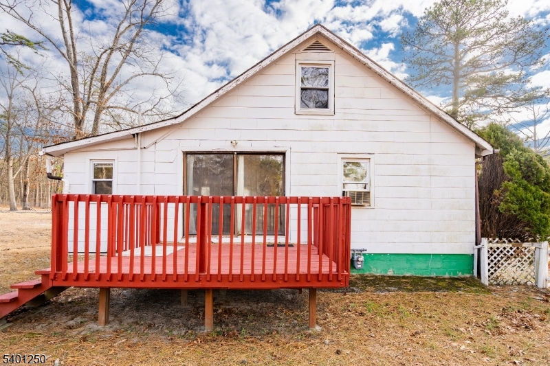491 Lakehurst Road Browns Mills, NJ 08015 - Photo 3 of 17 a view of a small house with backyard