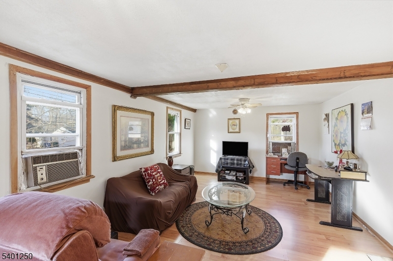 491 Lakehurst Road Browns Mills, NJ 08015 - Photo 5 of 17 a living room with furniture and a fireplace