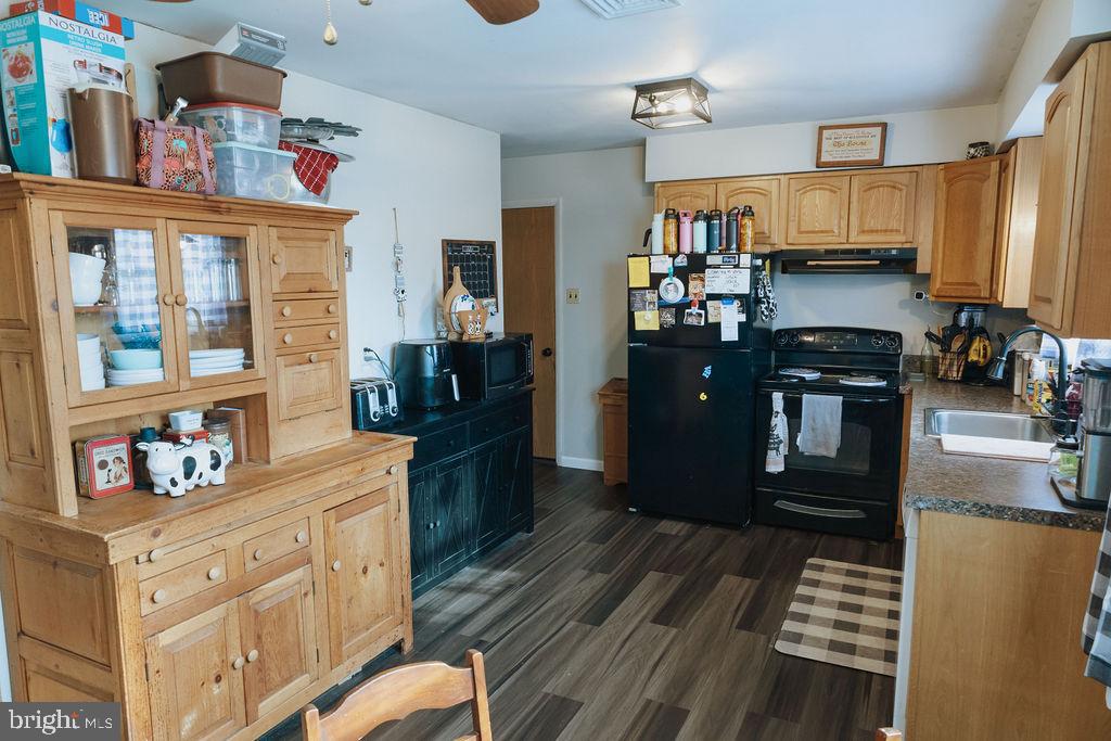 3483 Messersmith Road York, PA 17408 - Photo 4 of 18 a kitchen with stainless steel appliances a refrigerator and a stove