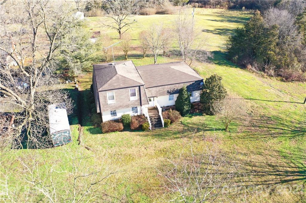 1023 George Taylor Road Monroe, NC 28110 - Photo 10 of 17 a view of a house with a yard