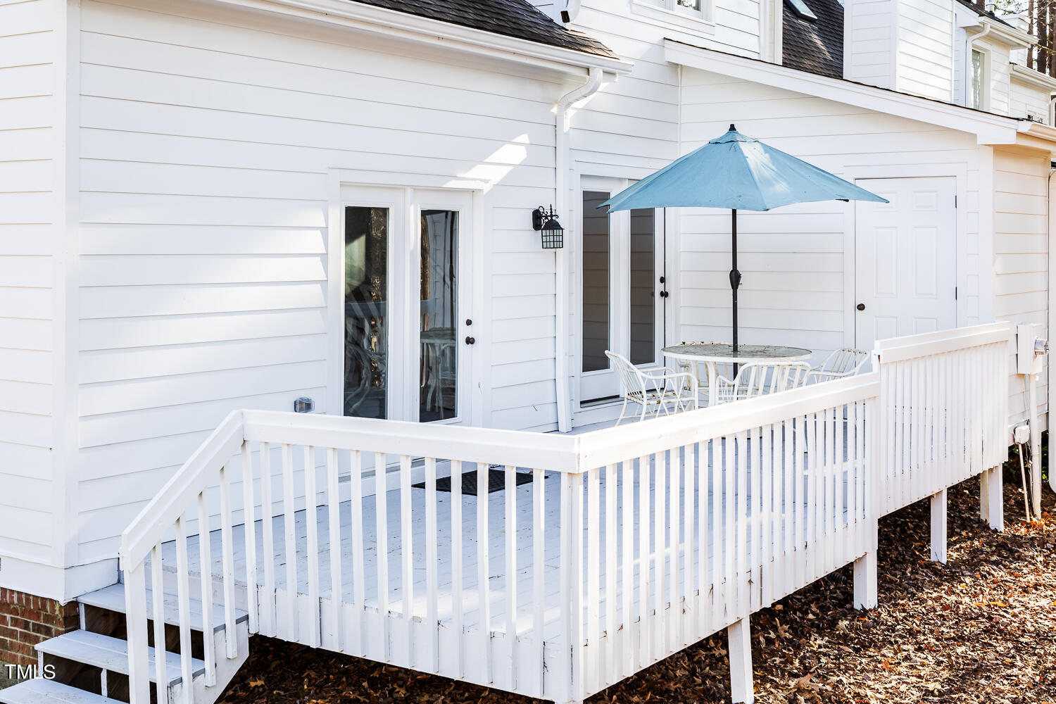 3717 Carnegie Lane Raleigh, NC 27612 - Photo 27 of 28 Oversized back deck with access to the living room and one of the secondary bedrooms.
