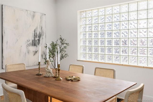 a dining room with a table and chairs in it