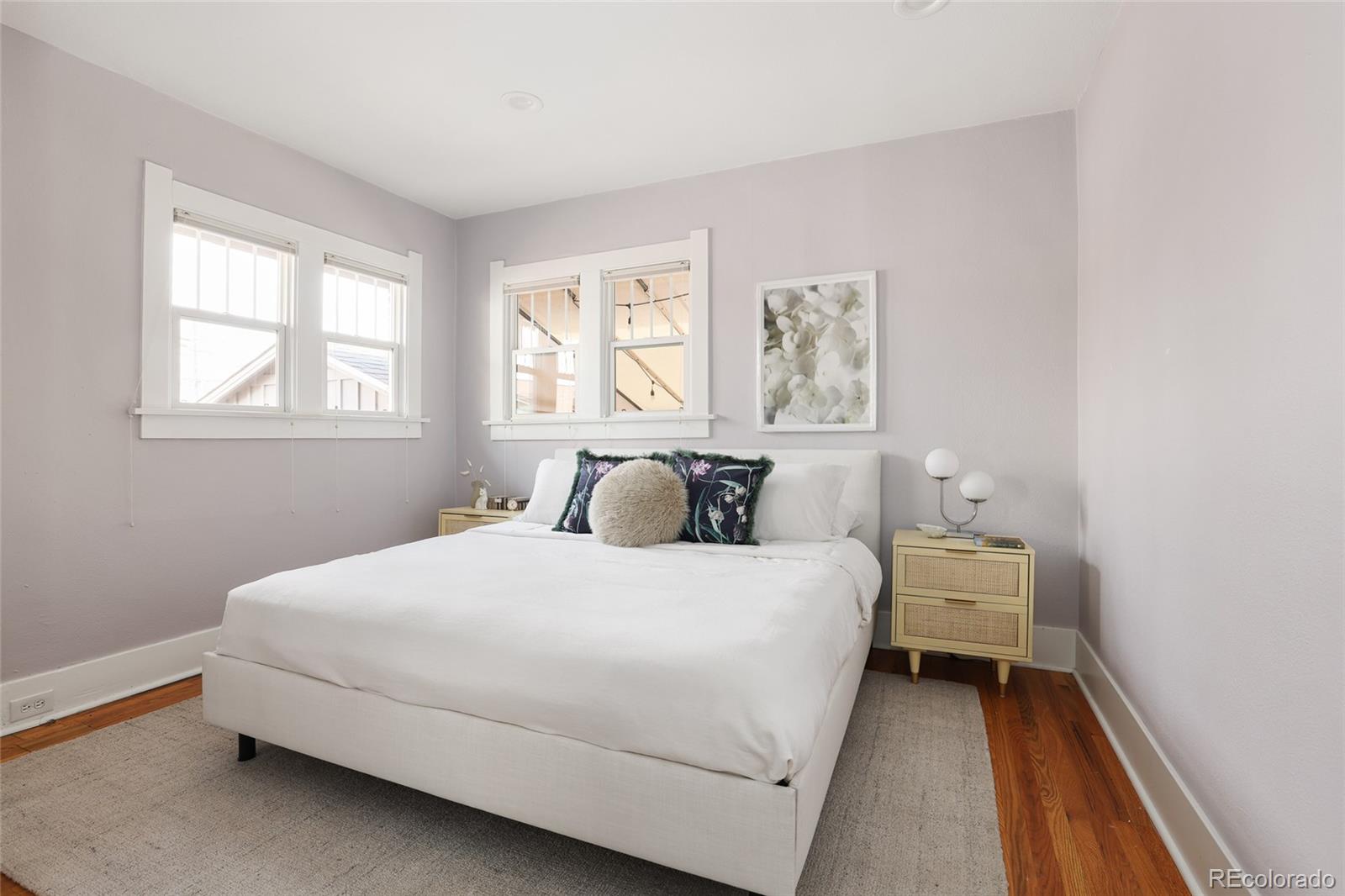 692 South Logan Street Denver, CO 80209 - Photo 15 of 40 a bedroom with a bed and a window