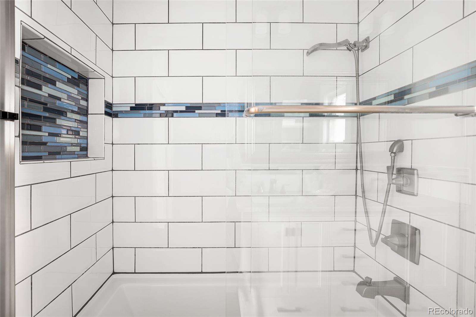 692 South Logan Street Denver, CO 80209 - Photo 17 of 40 a bathroom with a shower