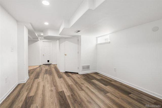 a view of room with wooden floor