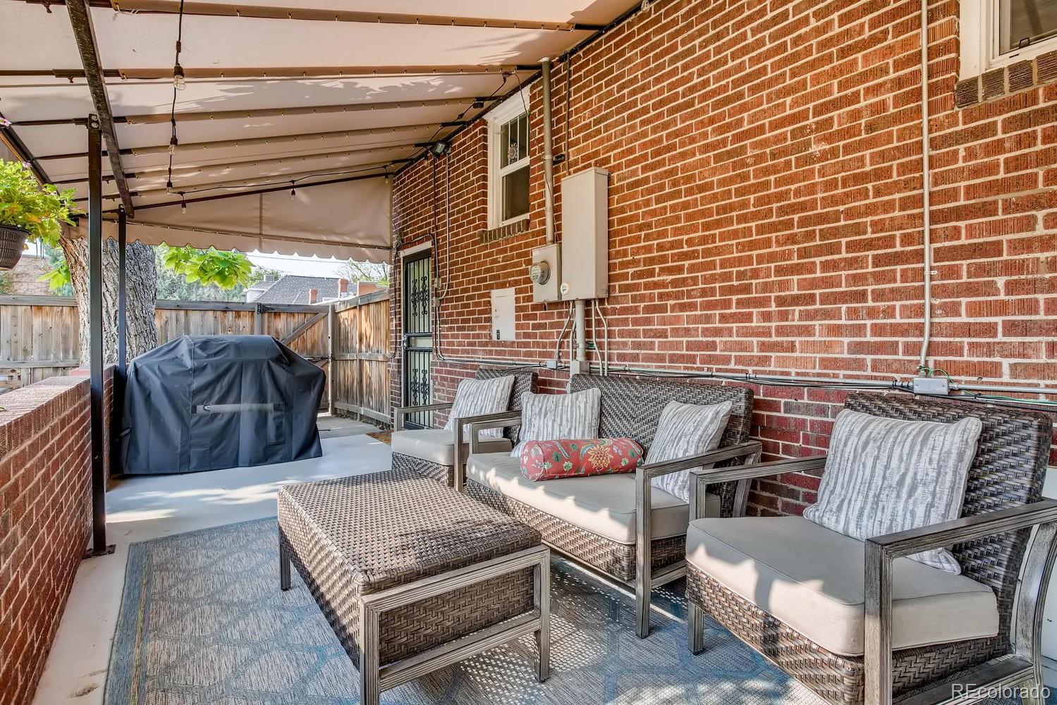 692 South Logan Street Denver, CO 80209 - Photo 29 of 40 a view of a patio with a table and chairs