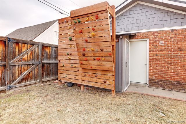 a view of a house with a yard and sitting area