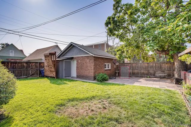 a view of a house with sitting area and furniture
