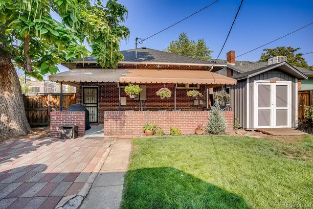 a backyard of a house with seating space