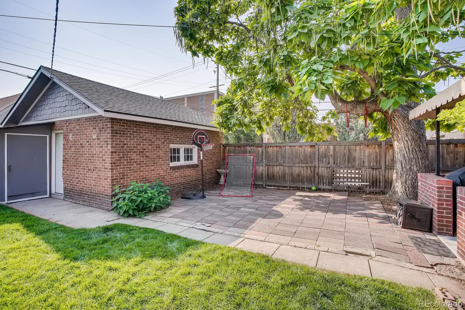 692 South Logan Street Denver, CO 80209 - Photo 36 of 40 a backyard of a house with seating space
