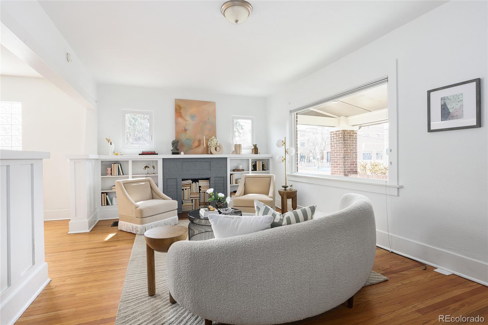692 South Logan Street Denver, CO 80209 - Photo 6 of 40 a living room with furniture and a wooden floor